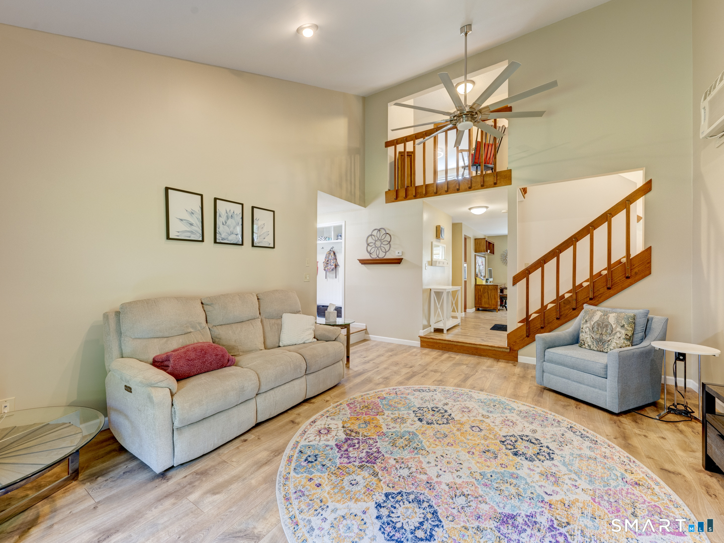 97 Lair Road New Hartford, CT 06057 - Photo 24 of 39 a living room with furniture and a rug