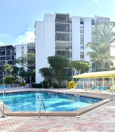 a view of swimming pool with outdoor seating