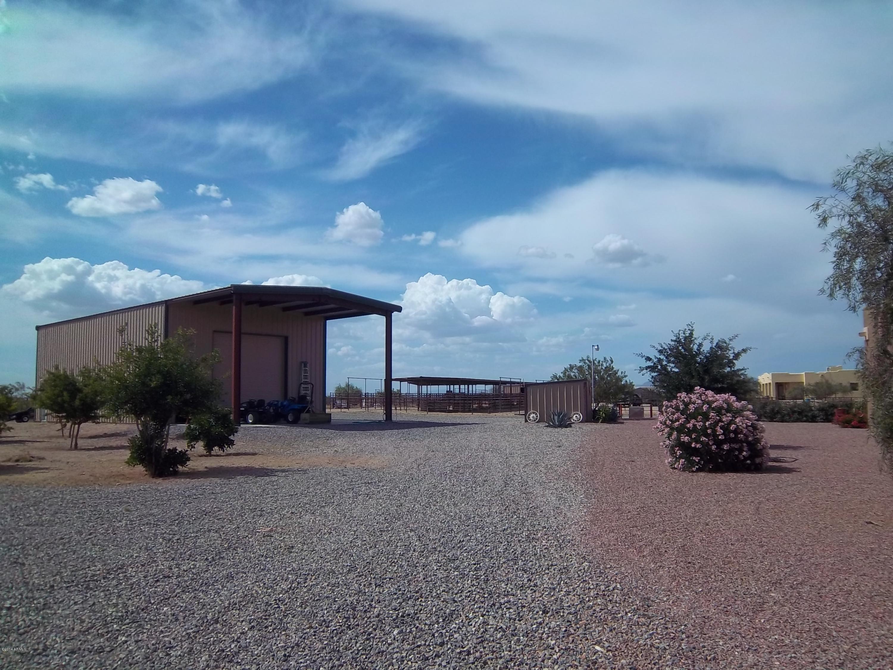 21117 West Steedridge Road Wittmann, AZ 85361 - Photo 34 of 66 Utility Bldg with overhang