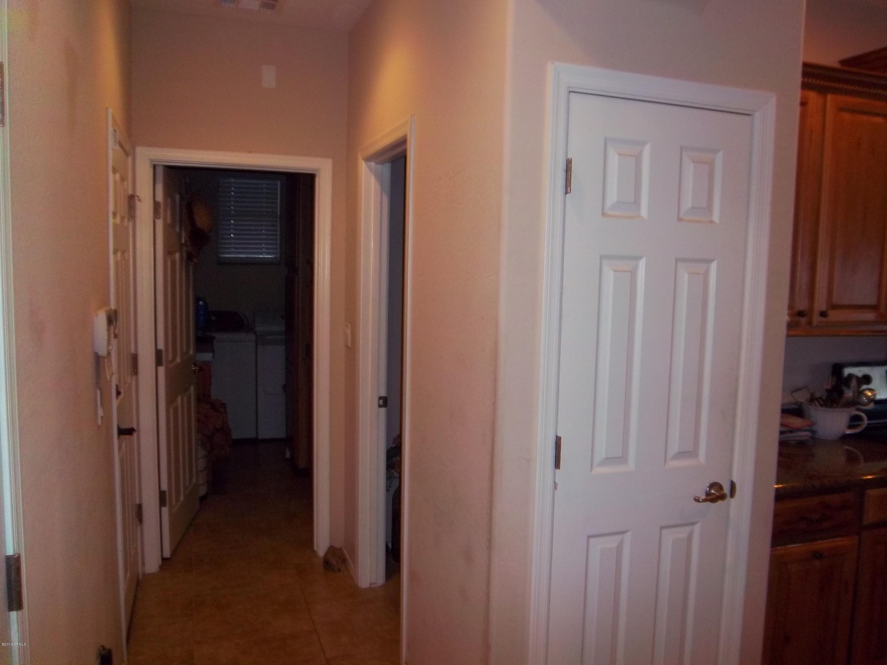 21117 West Steedridge Road Wittmann, AZ 85361 - Photo 36 of 66 Hall to laundry