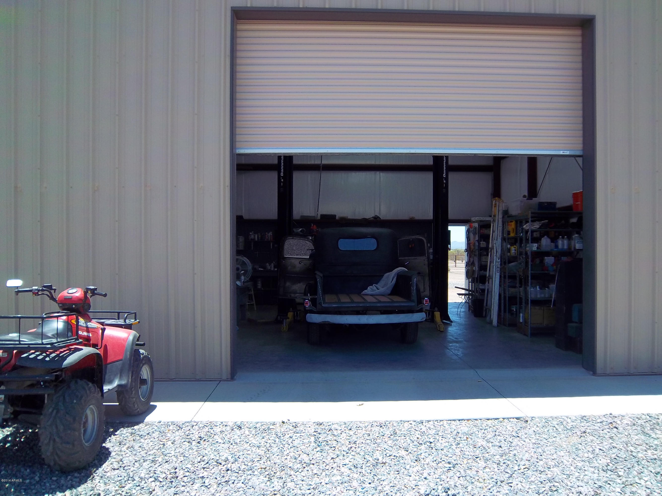 21117 West Steedridge Road Wittmann, AZ 85361 - Photo 46 of 66 Third Overhead Door w.Hoist!
