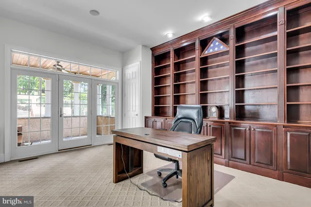 a kitchen with stainless steel appliances granite countertop a kitchen island hardwood floor sink and stove