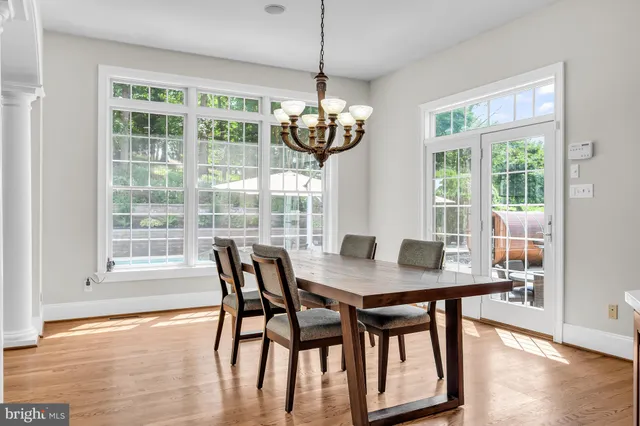a bathroom with a sink a mirror and a window