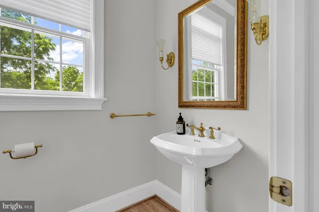 a living room with couches and a flat screen tv
