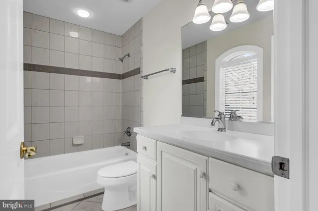 an aerial view of a house with outdoor space and sitting area