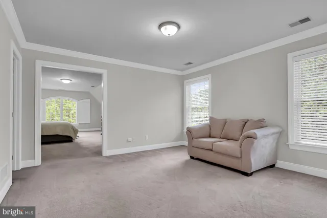 a view of backyard with seating space and trees