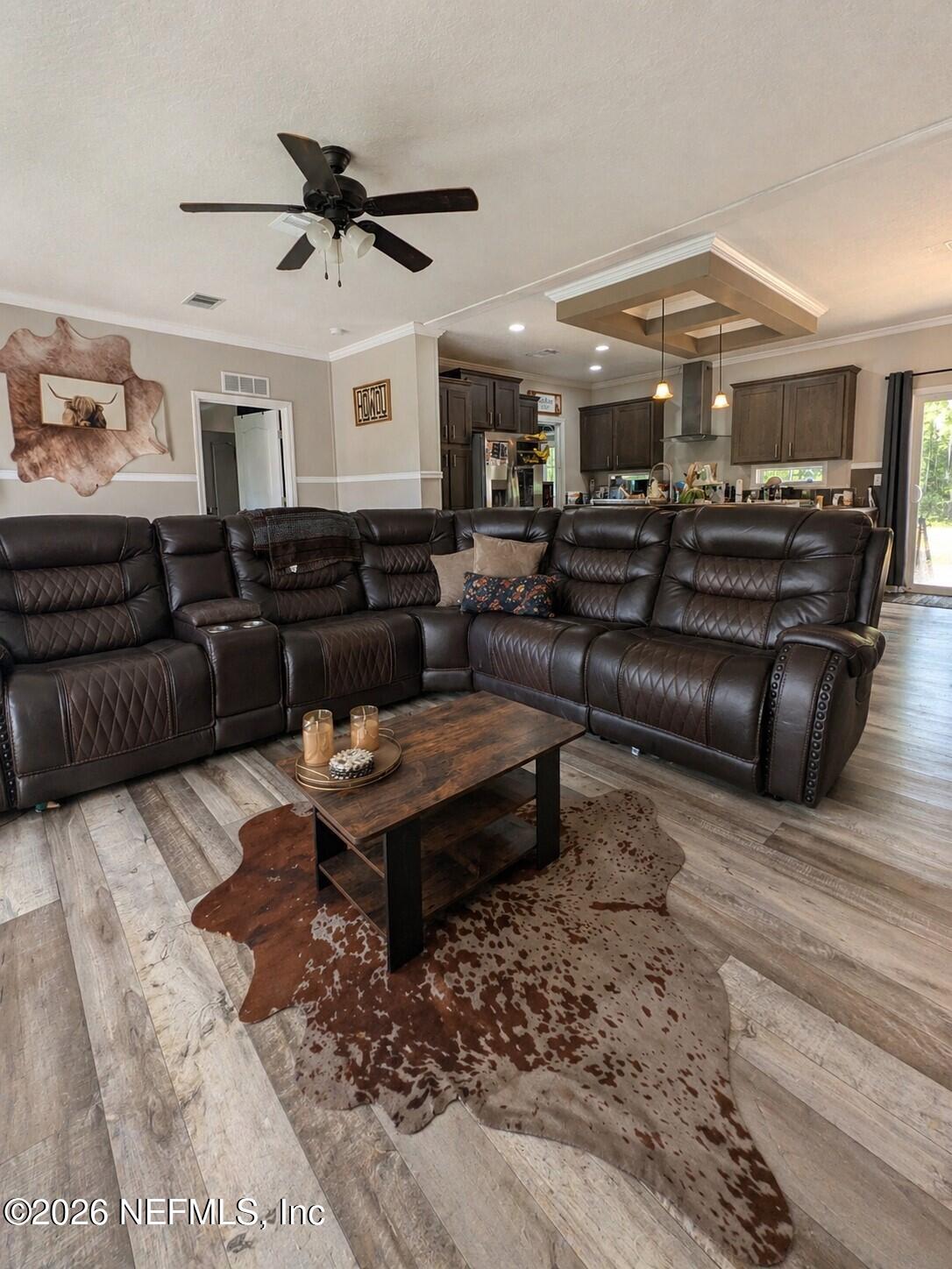 124 Jack Road Palatka, FL 32177 - Photo 2 of 18 a living room with furniture a ceiling fan and a rug