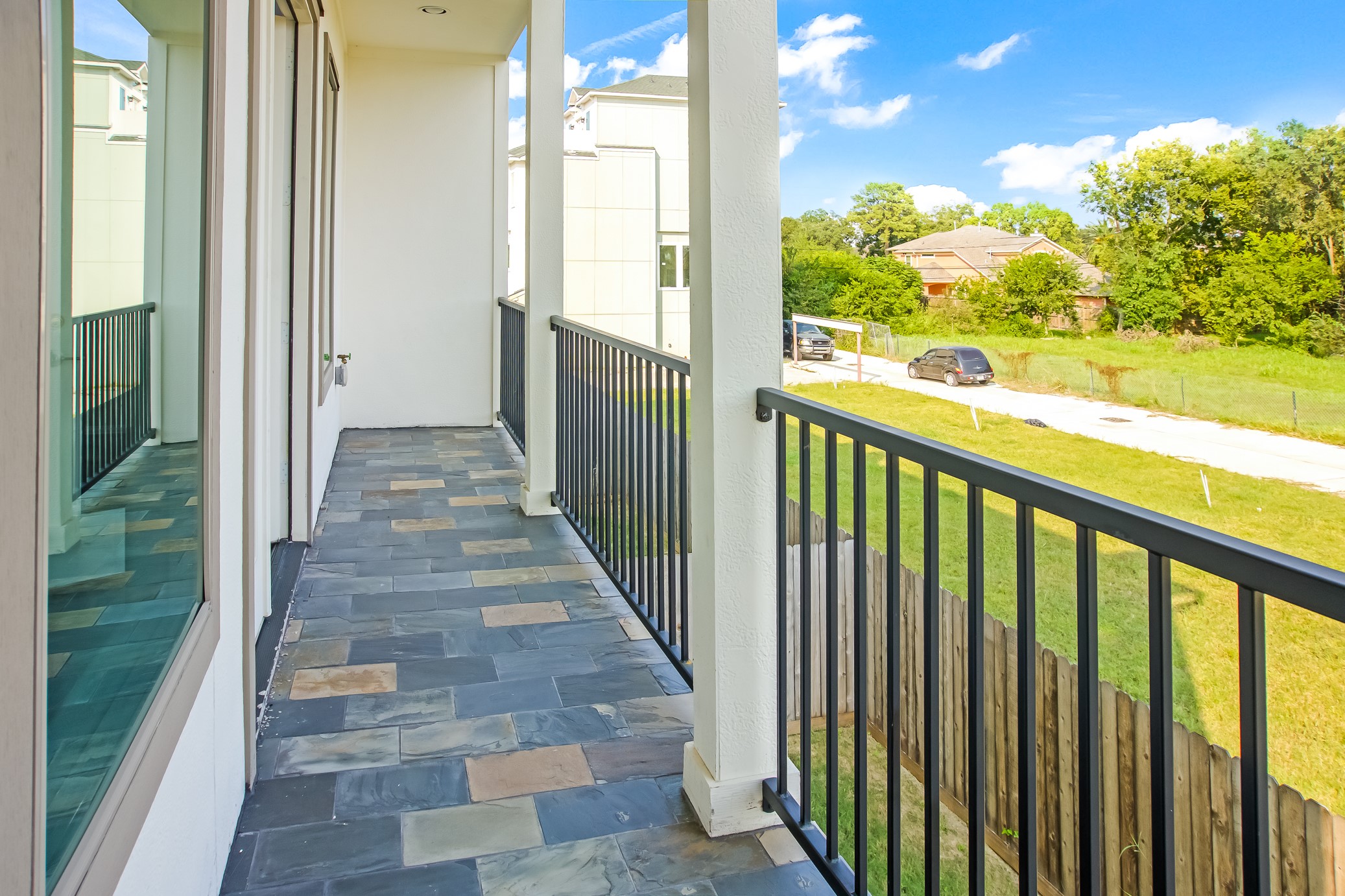 3909 Griggs Road Houston, TX 77021 - Photo 14 of 26 a view of a balcony with wooden floor