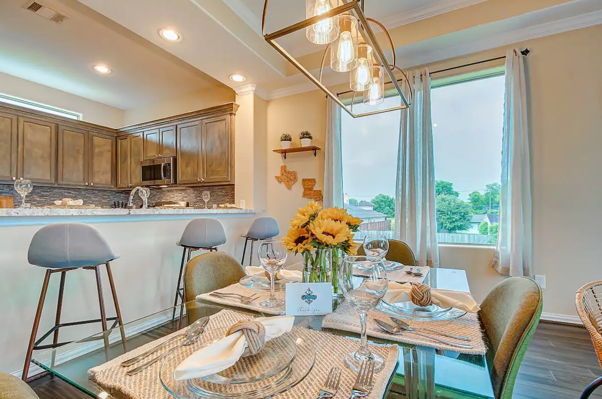 3909 Griggs Road Houston, TX 77021 - Photo 2 of 26 a living room with stainless steel appliances kitchen island granite countertop furniture and a large window