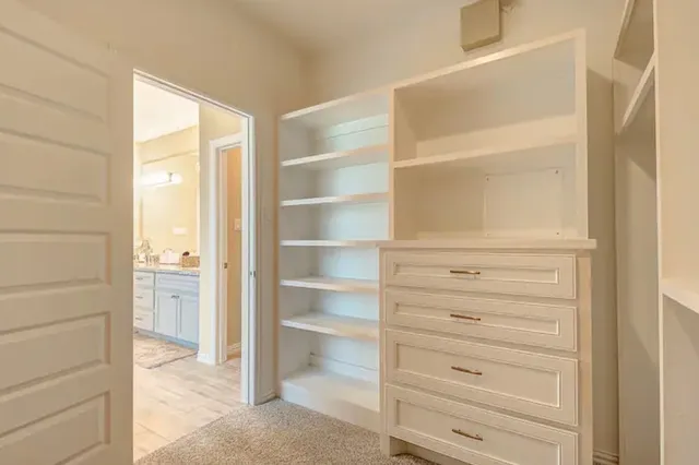 a view of closet area with empty racks