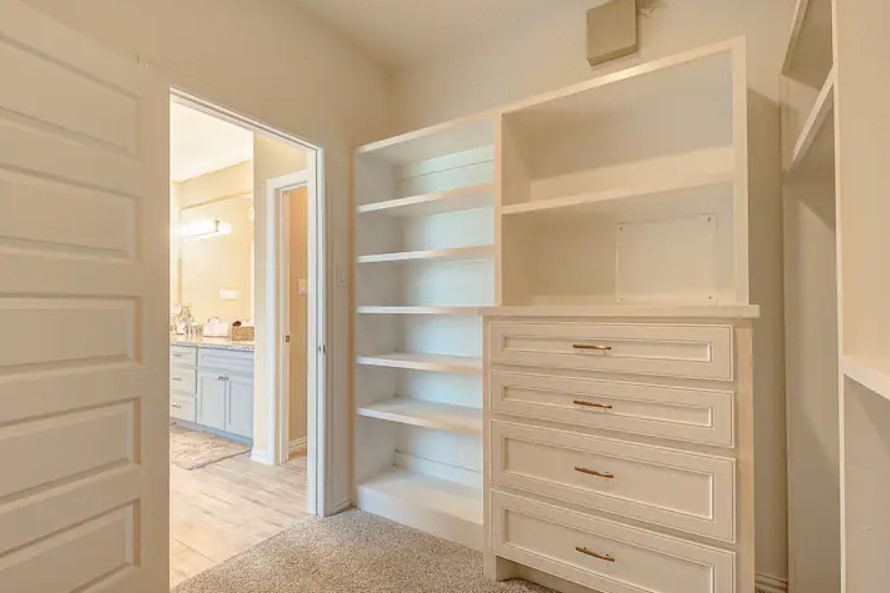 3909 Griggs Road Houston, TX 77021 - Photo 23 of 26 a view of closet area with empty racks