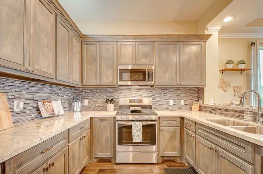 3909 Griggs Road Houston, TX 77021 - Photo 7 of 26 a kitchen with a sink stove and microwave