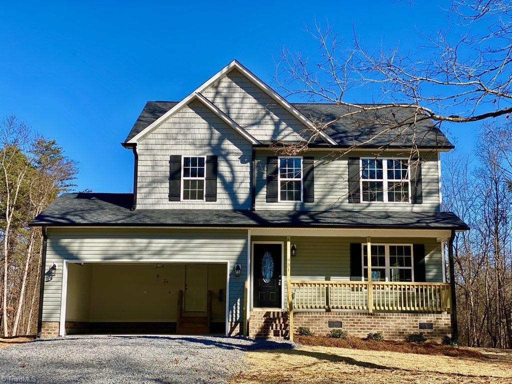 951 Eden Church Road Madison, NC 27025 - Photo 1 of 28 Exterior front view with covered porch and 2 car garage 12/31/19