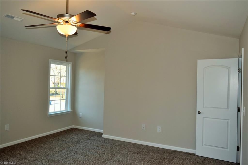 951 Eden Church Road Madison, NC 27025 - Photo 11 of 28 Master bedroom with vaulted ceiling and ceiling fan