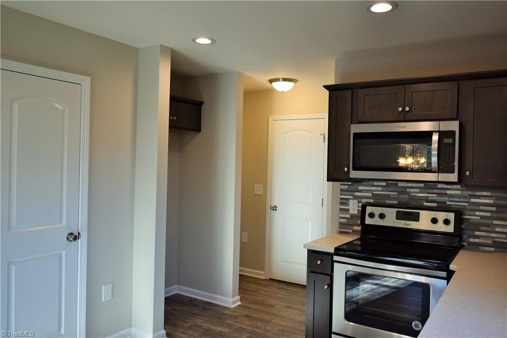 951 Eden Church Road Madison, NC 27025 - Photo 8 of 28 Additional kitchen view with pantry and door to garage