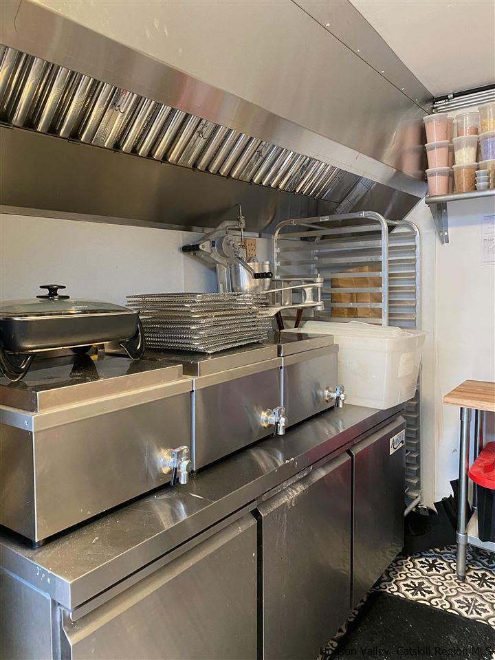 744-746 Broadway Kingston, NY 12401 - Photo 12 of 28 a open kitchen with stainless steel appliances granite countertop a stove and a sink