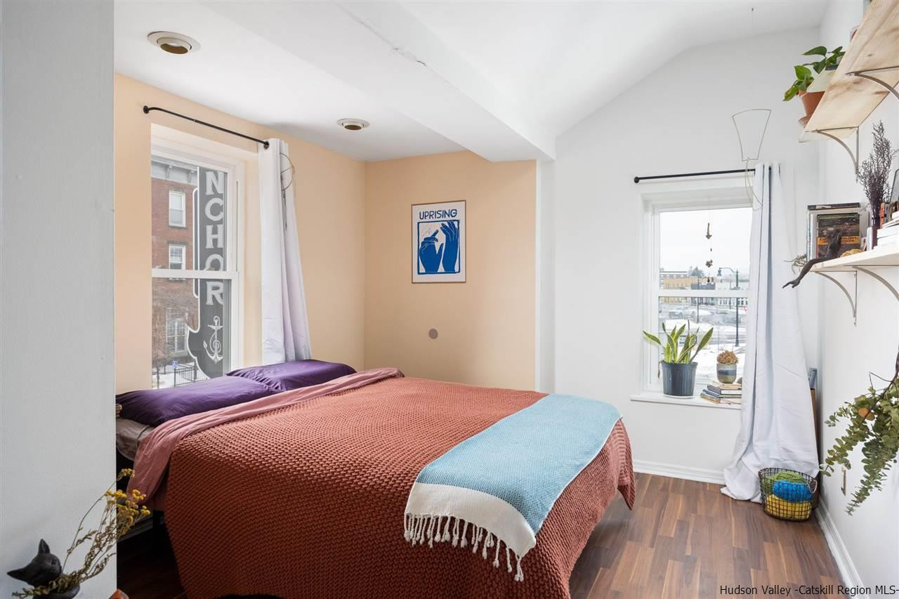 744-746 Broadway Kingston, NY 12401 - Photo 16 of 28 a bedroom with a bed and a window