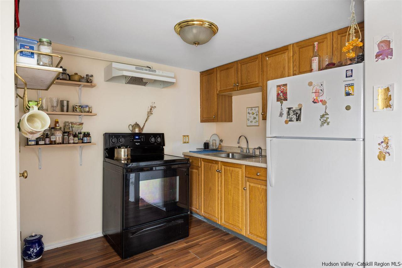 744-746 Broadway Kingston, NY 12401 - Photo 17 of 28 a kitchen with stainless steel appliances a refrigerator and a stove