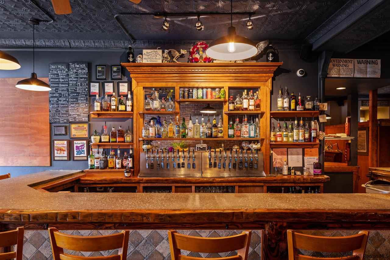 744-746 Broadway Kingston, NY 12401 - Photo 2 of 28 a roof deck with a table and chairs