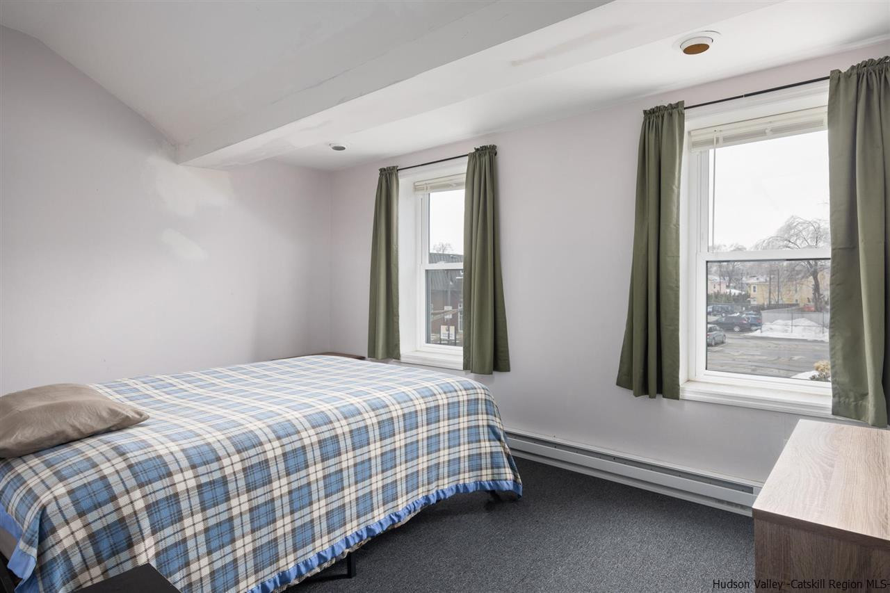 744-746 Broadway Kingston, NY 12401 - Photo 21 of 28 a bedroom with a bed and window