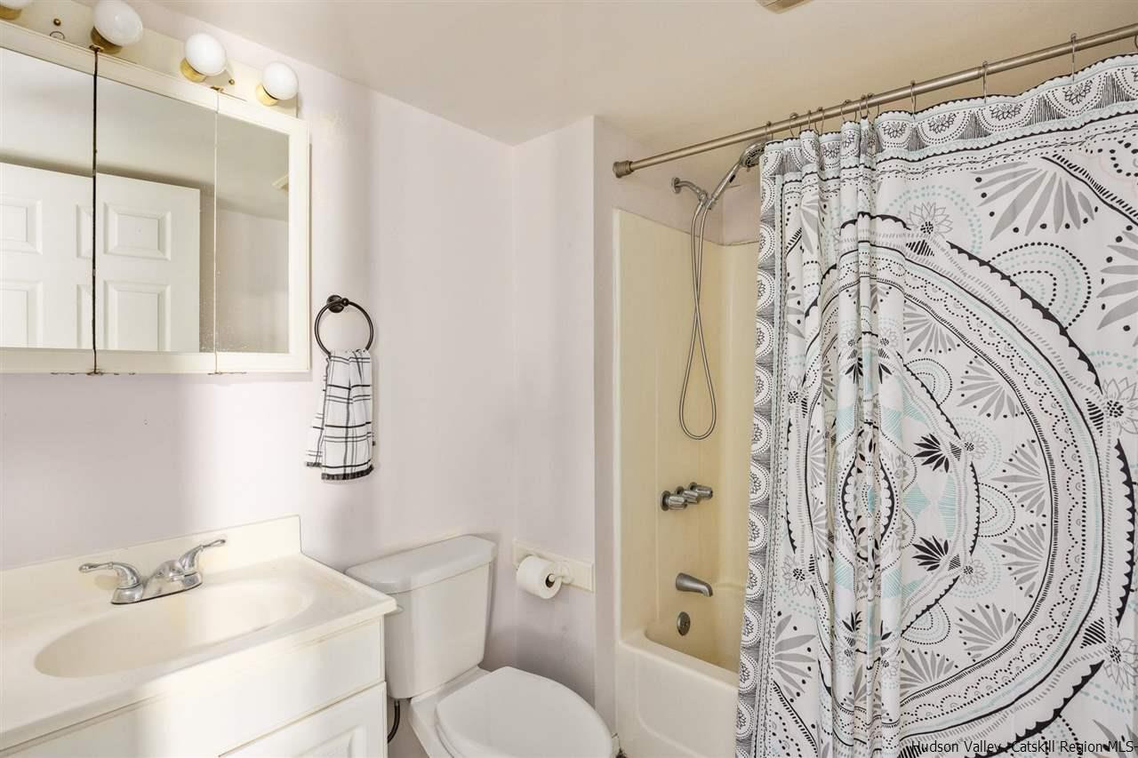 744-746 Broadway Kingston, NY 12401 - Photo 23 of 28 a bathroom with a toilet sink shower and mirror