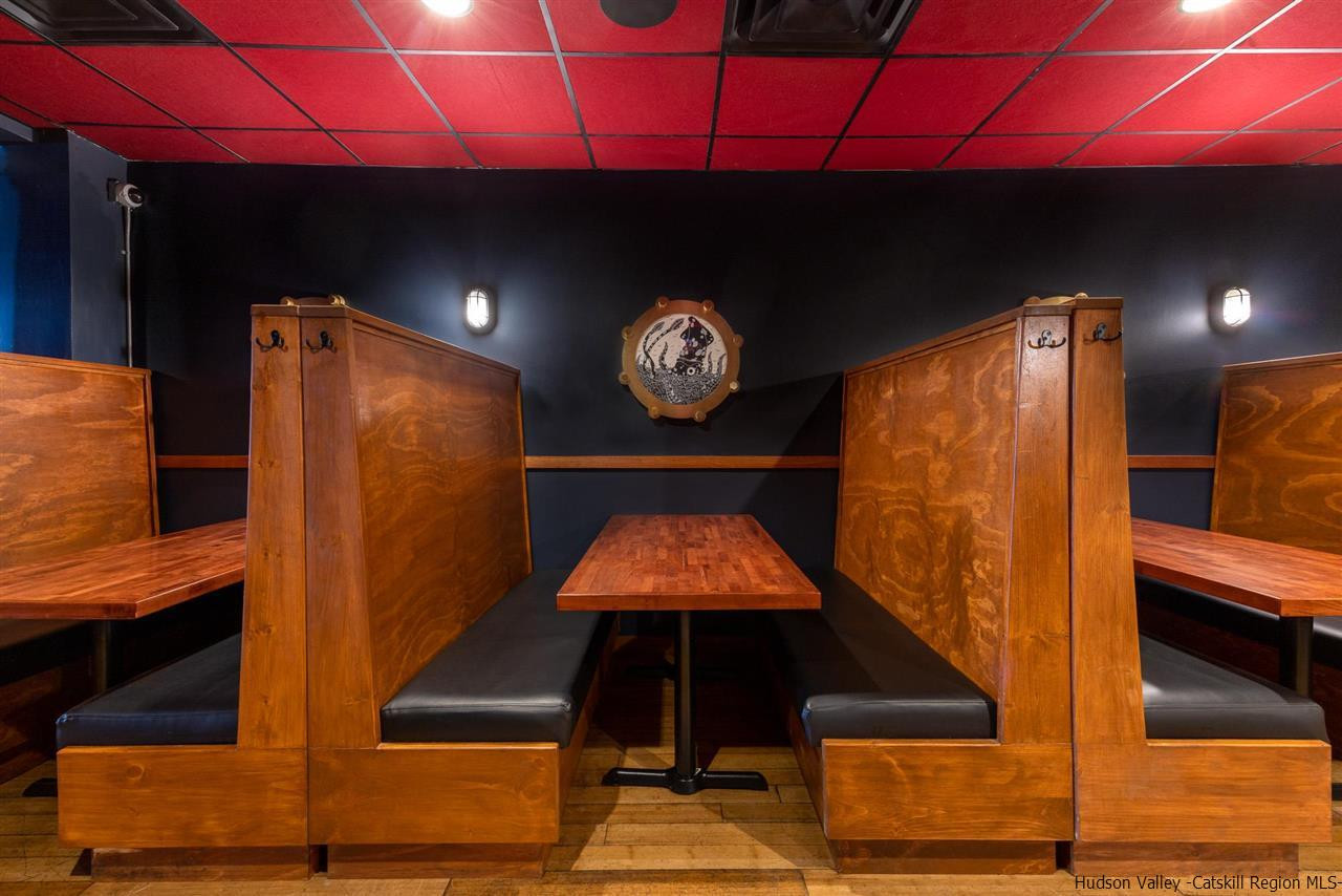 744-746 Broadway Kingston, NY 12401 - Photo 5 of 28 a room with furniture and a potted plant