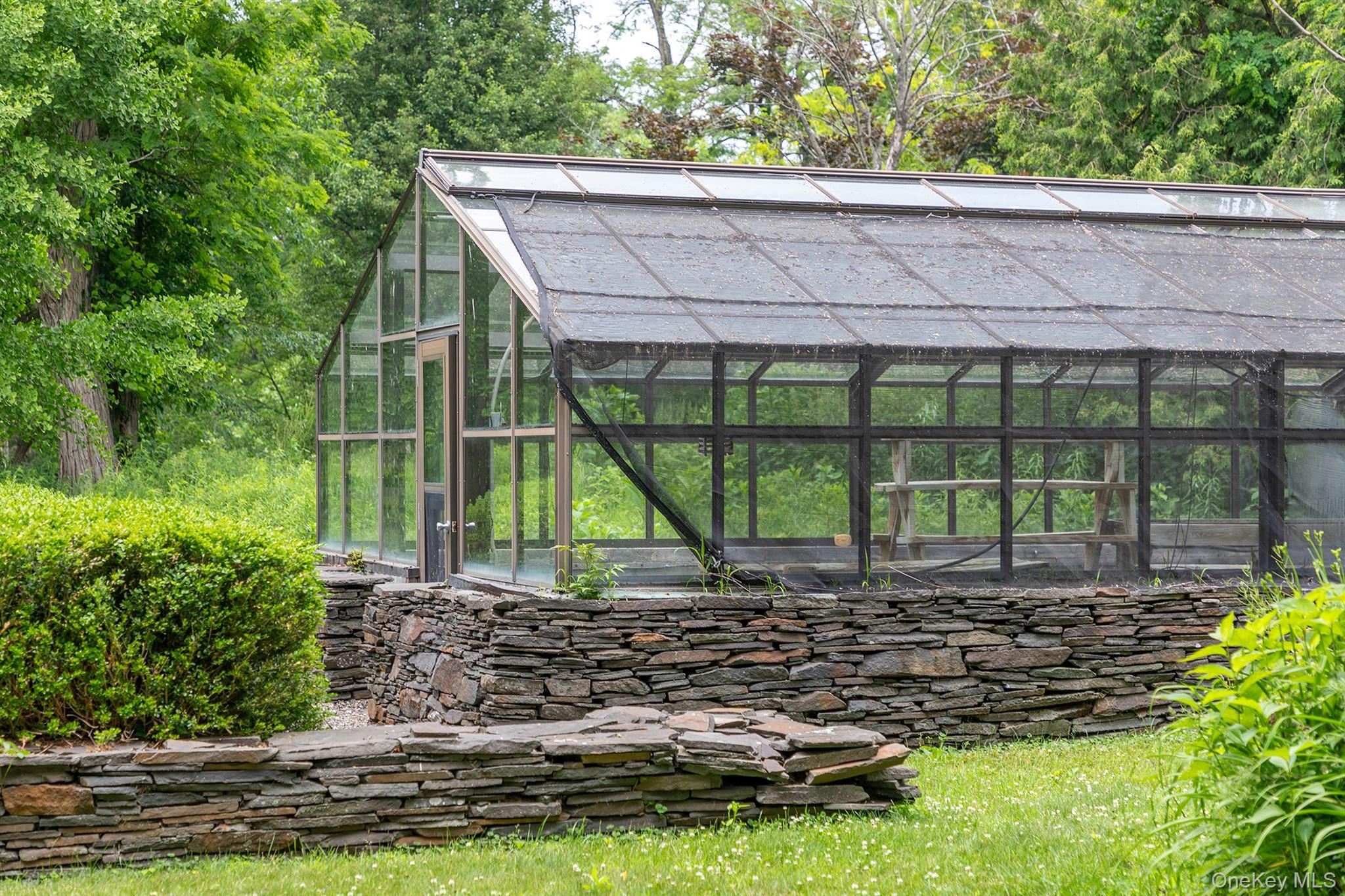 202 Buckwheat Road Hudson, NY 12534 - Photo 36 of 49 a view of a backyard with plants and garden