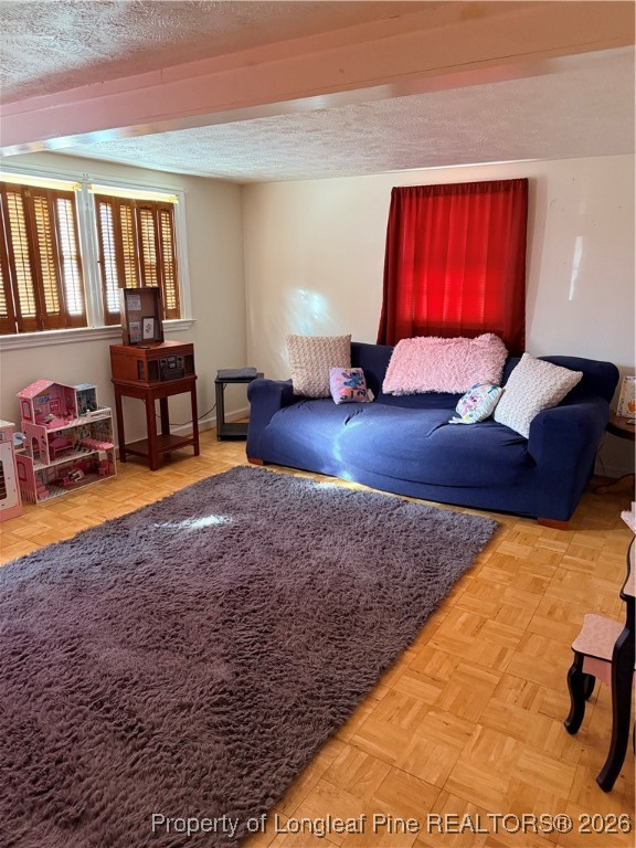 655 Wiltshire Road Fayetteville, NC 28314 - Photo 13 of 17 a living room with furniture rug and lamp