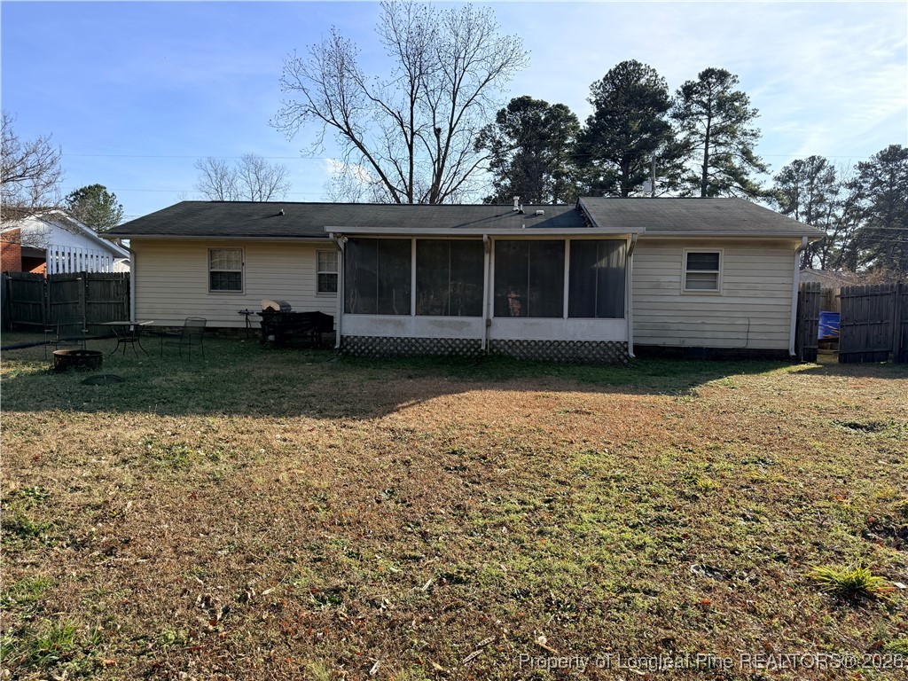 655 Wiltshire Road Fayetteville, NC 28314 - Photo 16 of 17 a view of a house with a garden and trees
