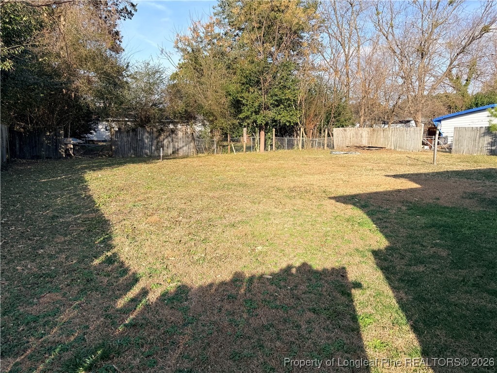655 Wiltshire Road Fayetteville, NC 28314 - Photo 17 of 17 a swimming pool with yard and trees