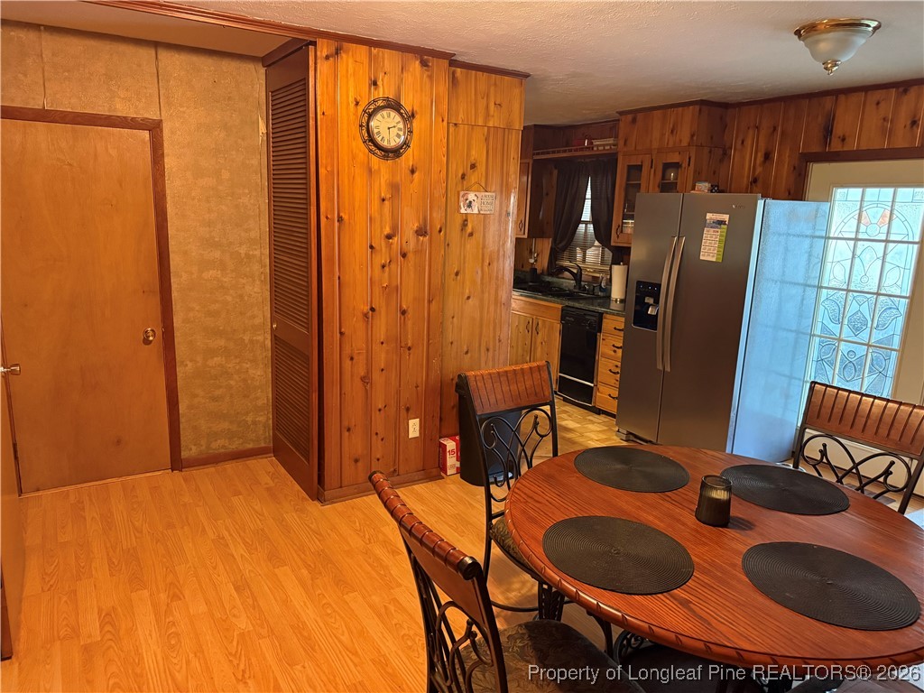 655 Wiltshire Road Fayetteville, NC 28314 - Photo 4 of 17 a bedroom with a bed and gym equipment
