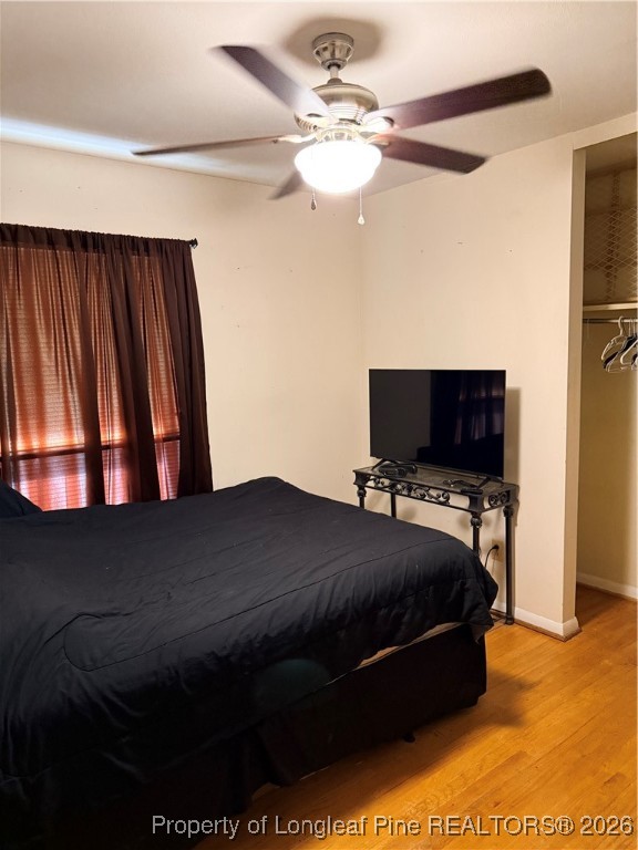655 Wiltshire Road Fayetteville, NC 28314 - Photo 7 of 17 a bedroom with a bed and a flat screen tv