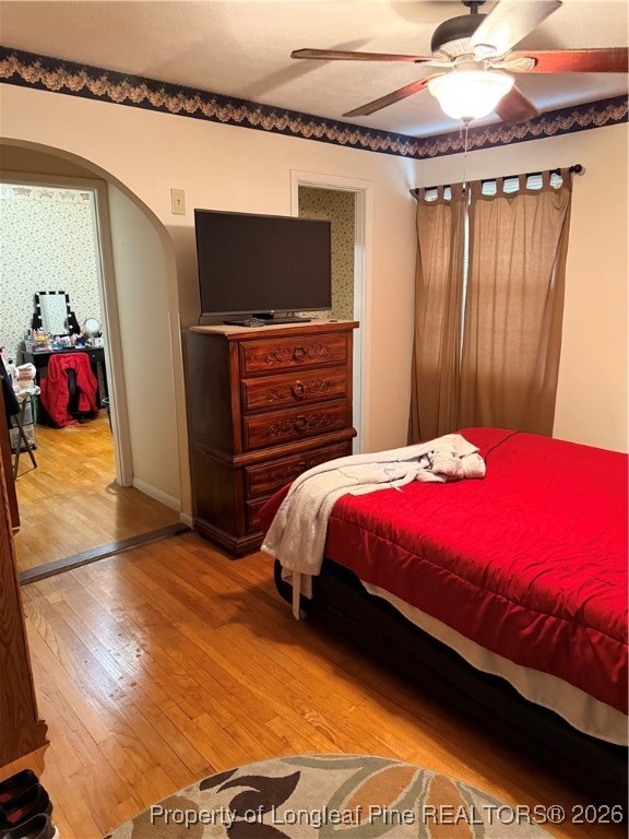 655 Wiltshire Road Fayetteville, NC 28314 - Photo 9 of 17 a bedroom with a bed and a flat screen tv