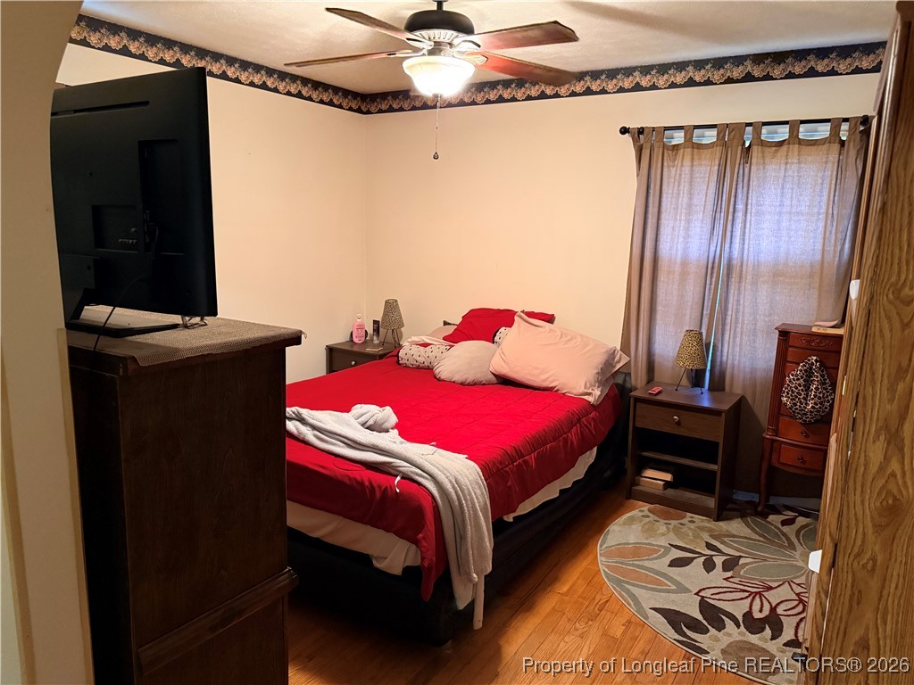 655 Wiltshire Road Fayetteville, NC 28314 - Photo 10 of 17 a bedroom with a bed and a mirror