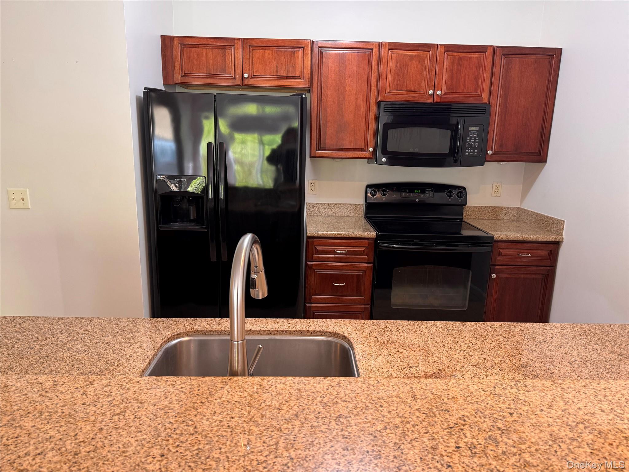 935 Tower Ridge Circle Middletown, NY 10941 - Photo 12 of 23 a kitchen with a sink and a microwave