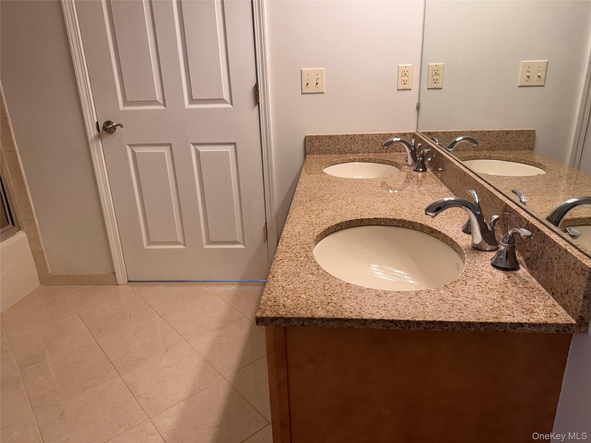 935 Tower Ridge Circle Middletown, NY 10941 - Photo 16 of 23 a bathroom with a granite countertop sink and a mirror