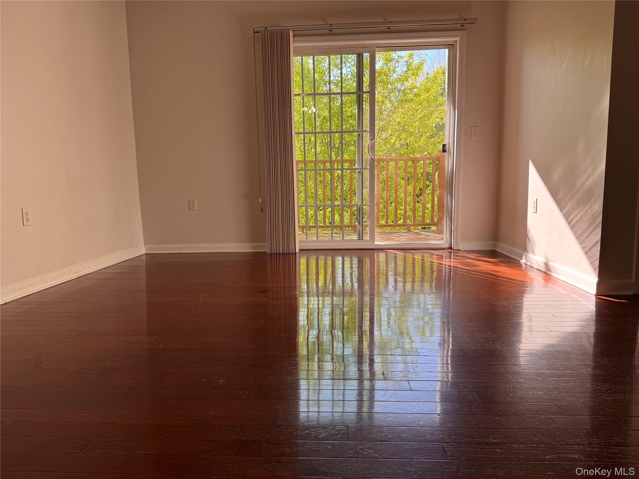 935 Tower Ridge Circle Middletown, NY 10941 - Photo 18 of 23 a view of an empty room with wooden floor and a window