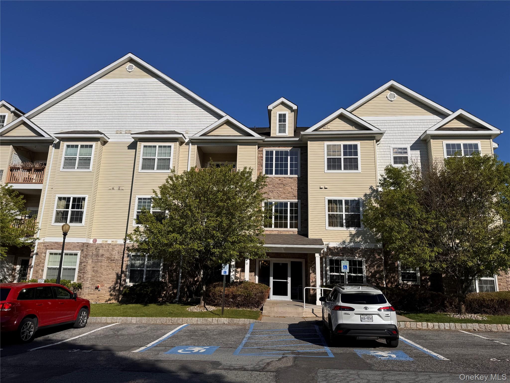 935 Tower Ridge Circle Middletown, NY 10941 - Photo 2 of 23 a car parked in front of a white building