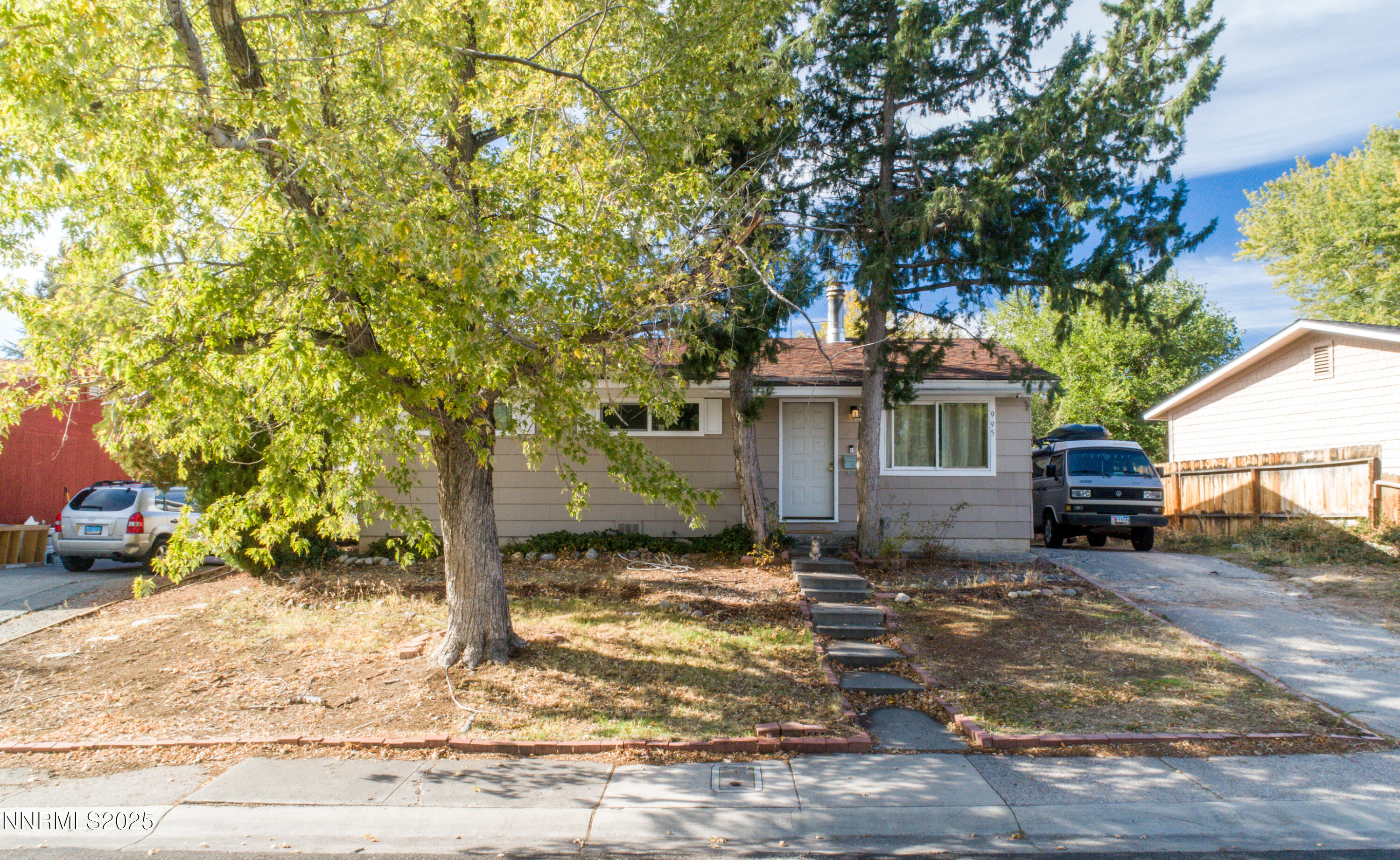 995 Beldon Way Reno, NV 89503 - Photo 1 of 17 a view of a house with a tree in the background