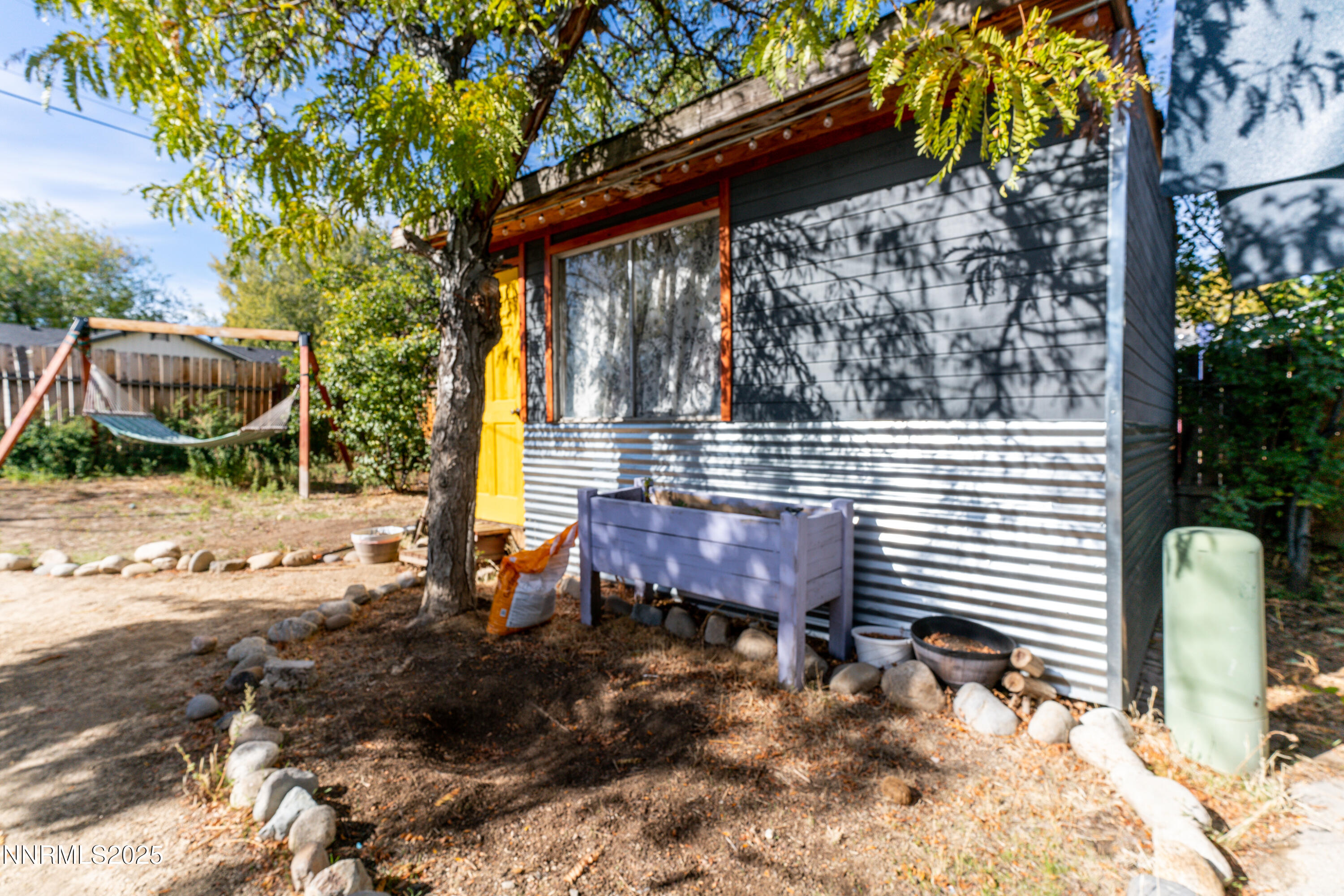 995 Beldon Way Reno, NV 89503 - Photo 17 of 17 a view of a wooden chairs and bench in the backyard