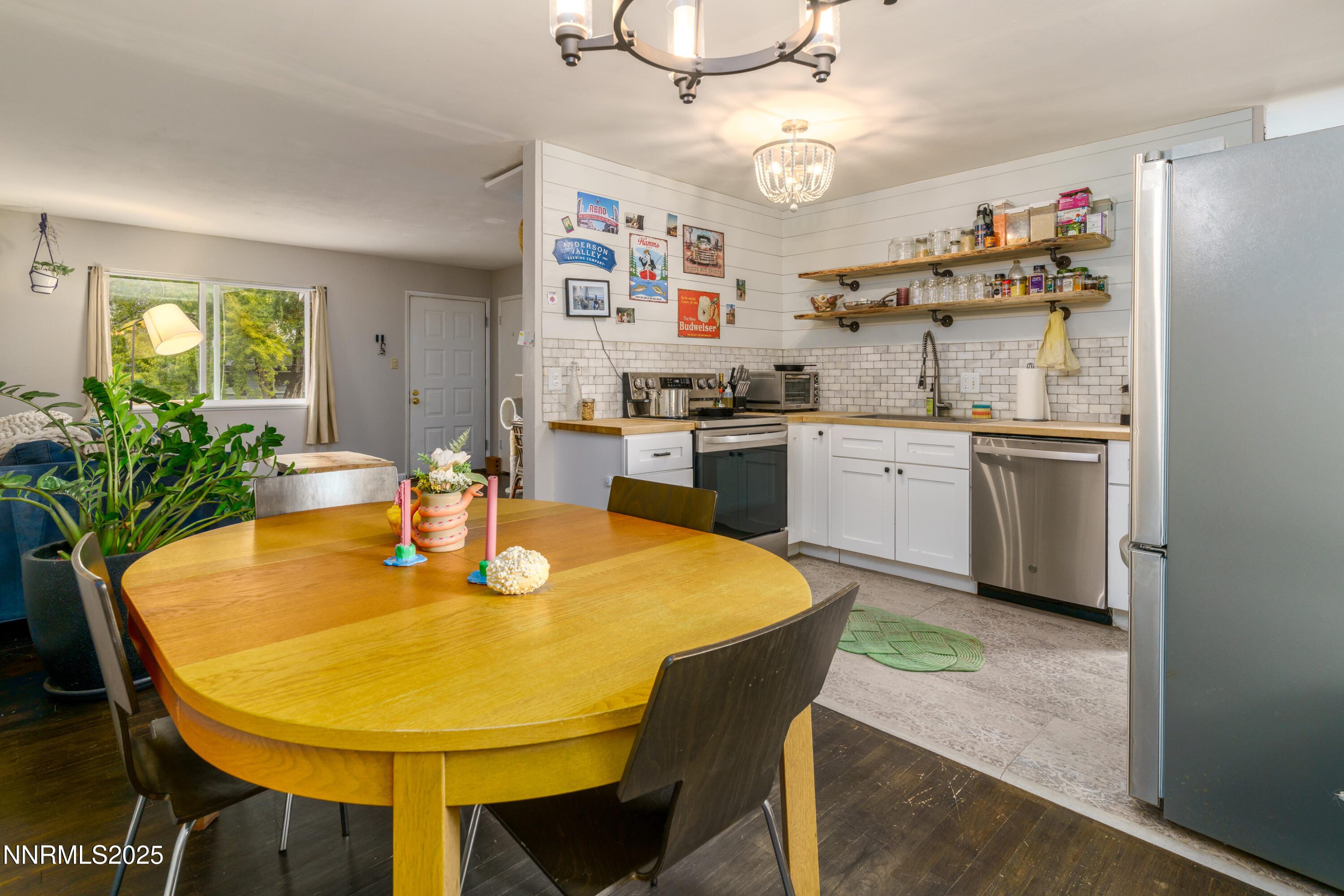 995 Beldon Way Reno, NV 89503 - Photo 8 of 17 a kitchen with a table chairs stove and refrigerator