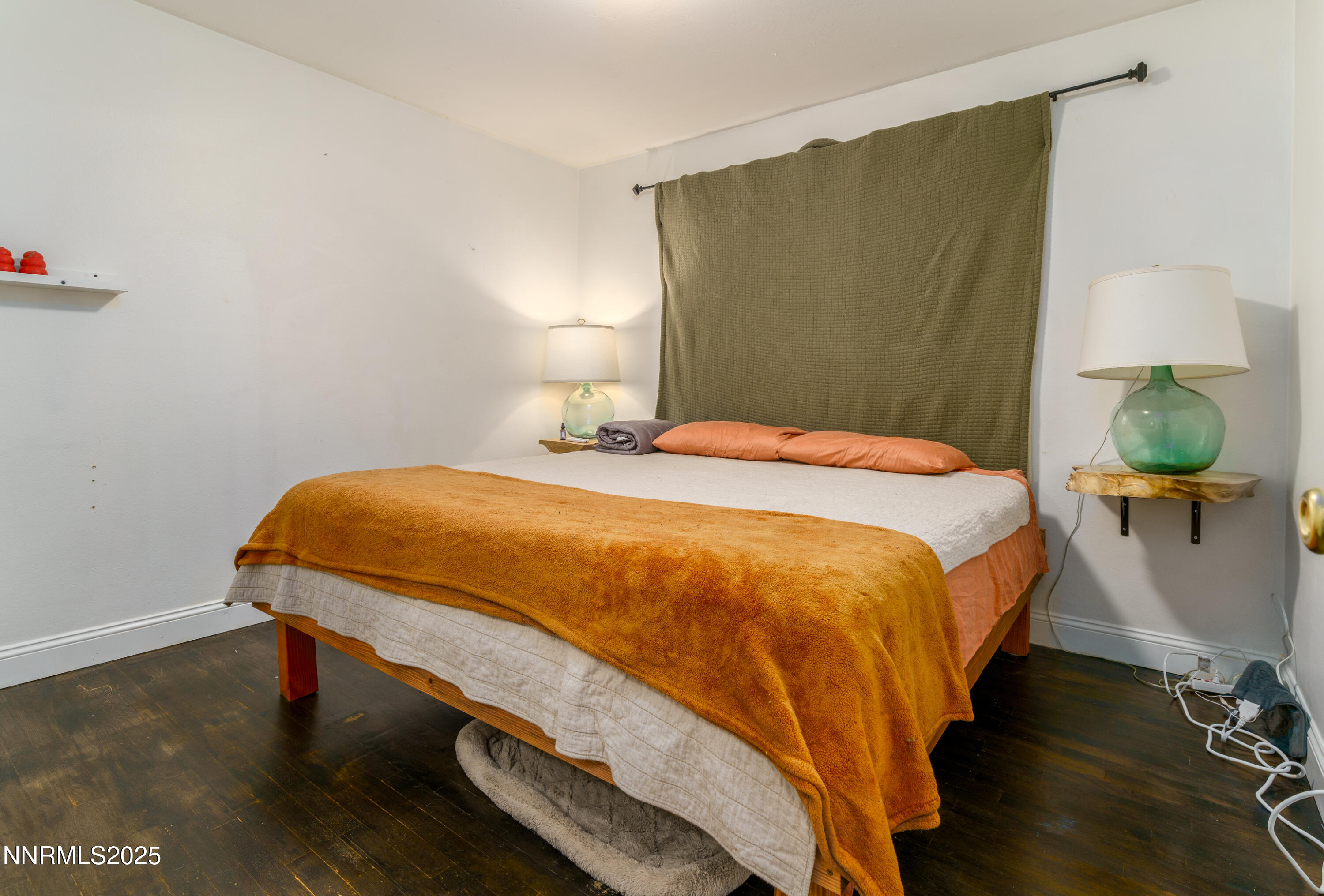 995 Beldon Way Reno, NV 89503 - Photo 10 of 17 a bedroom with a bed table and a lamp
