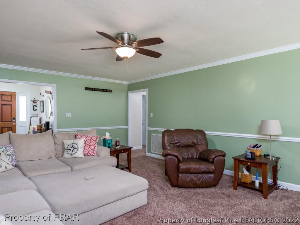 7790 Dragonhead Road Fayetteville, NC 28311 - Photo 12 of 36 a living room with furniture and a couch