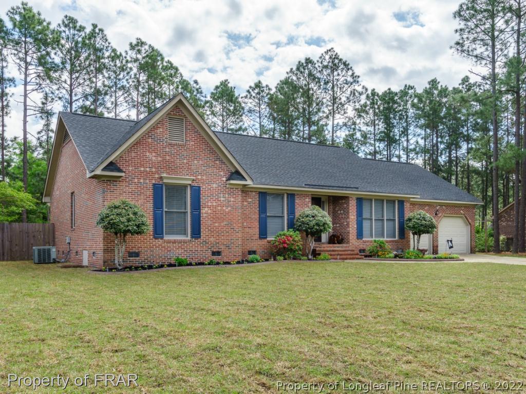 7790 Dragonhead Road Fayetteville, NC 28311 - Photo 2 of 36 a front view of a house with garden