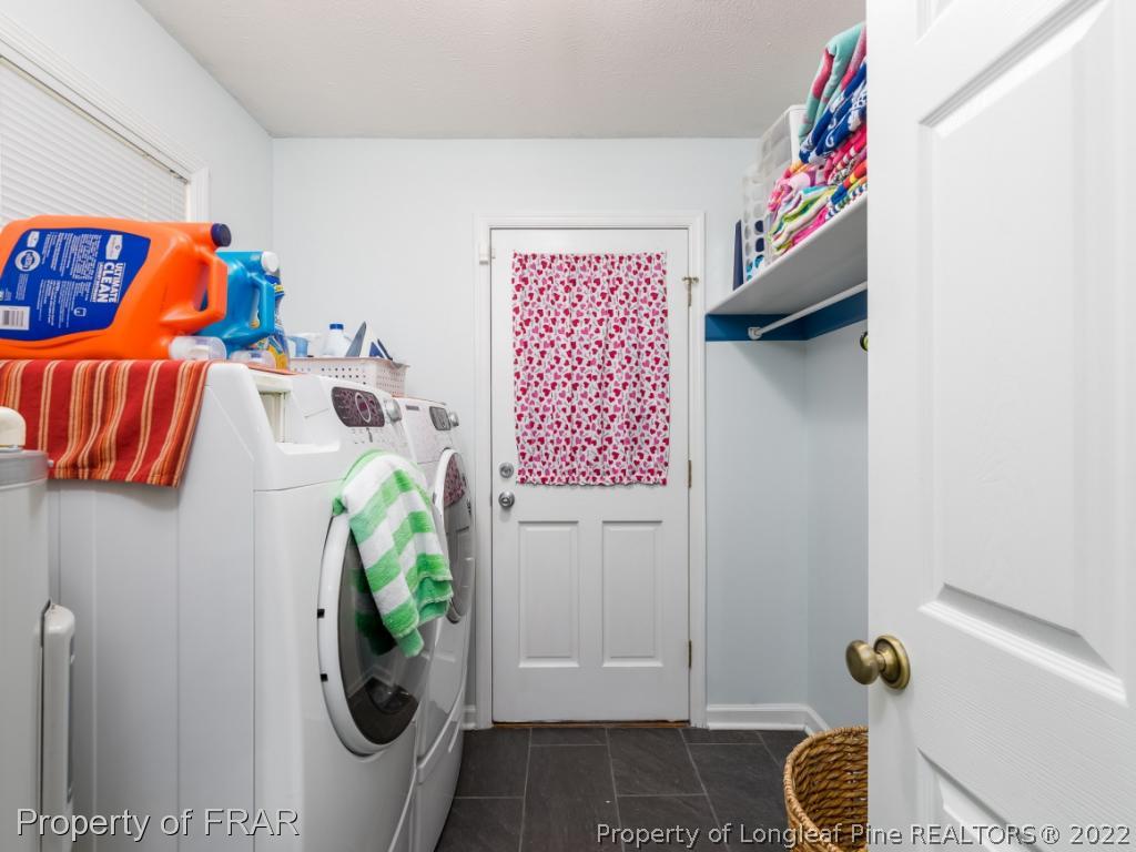 7790 Dragonhead Road Fayetteville, NC 28311 - Photo 26 of 36 a bathroom with a sink toilet and shower