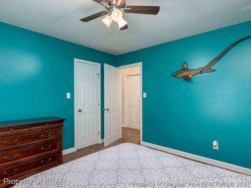 7790 Dragonhead Road Fayetteville, NC 28311 - Photo 36 of 36 an empty room with closet and windows
