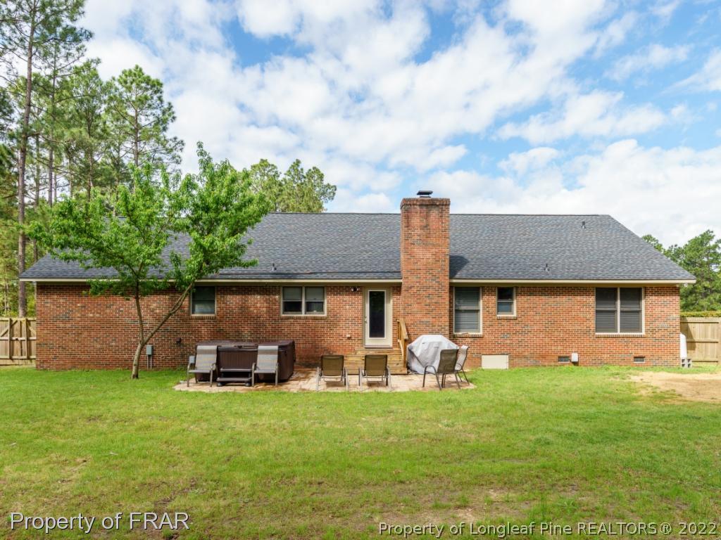 7790 Dragonhead Road Fayetteville, NC 28311 - Photo 5 of 36 a front view of house with yard and seating area