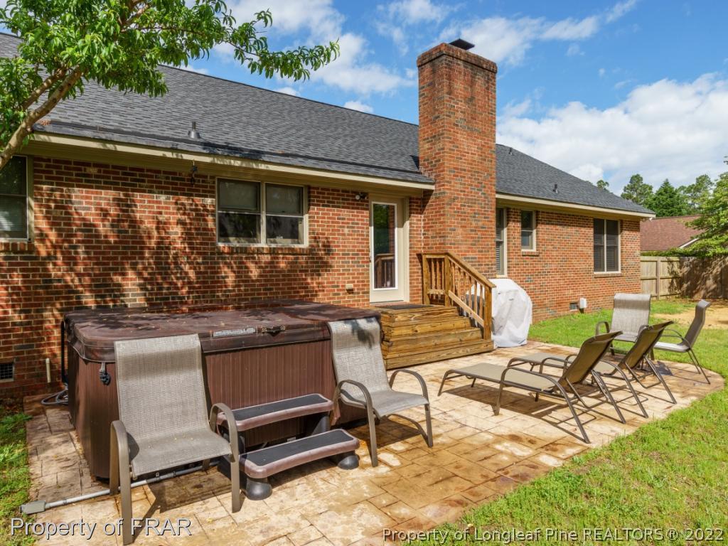 7790 Dragonhead Road Fayetteville, NC 28311 - Photo 6 of 36 a backyard of a house with outdoor seating
