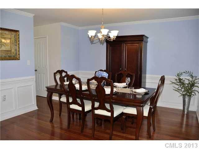 205 Lind Point Lane Monroe, NC 28110 - Photo 3 of 16 a view of a dining room with furniture and chandelier