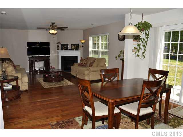 205 Lind Point Lane Monroe, NC 28110 - Photo 6 of 16 a view of a dining room with furniture and chandelier